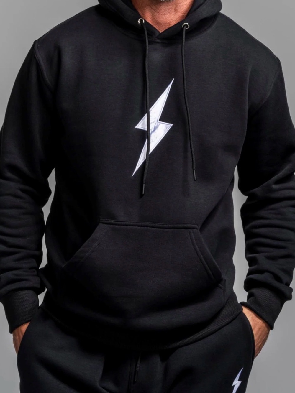 Bruce Bolt Youth Black Hoodie with White Lightning Bolt - youth size M